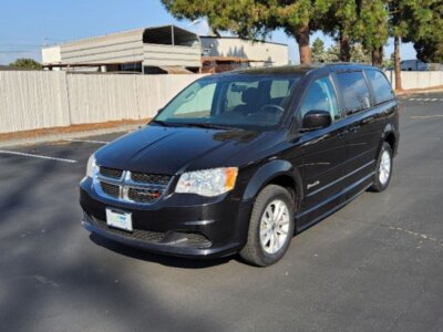 Black Dodge Grand Caravan with BraunAbility Side Entry Manual Fold Out conversion