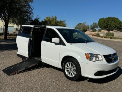 White Dodge Grand Caravan with Adaptive Vans Side Entry Automatic Fold Out conversion
