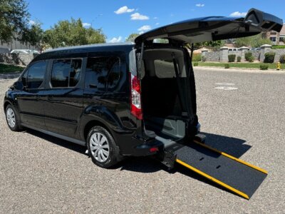 Black Ford Transit Connect with Driverge Rear Entry Manual Fold Out conversion