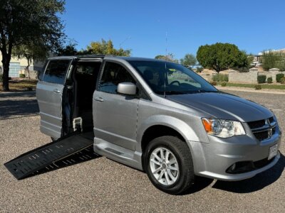 Silver Dodge Grand Caravan with BraunAbility Side Entry Automatic Fold Out conversion