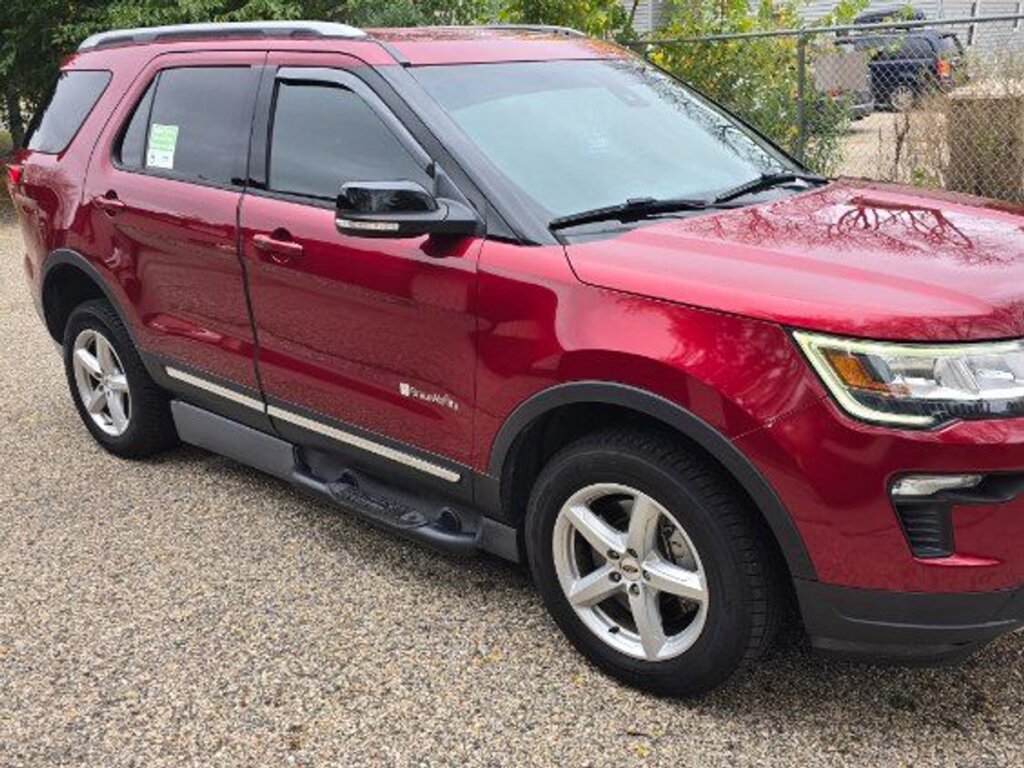 Red Ford Explorer with BraunAbility Side Entry Automatic In Floor conversion
