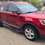 Red Ford Explorer with BraunAbility Side Entry Automatic In Floor conversion