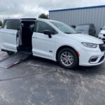 White Chrysler Pacifica with Driverge Side Entry Automatic Fold Out conversion