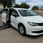 White Chrysler Voyager with Driverge Side Entry Automatic Fold Out conversion