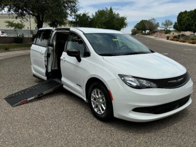 White Chrysler Voyager with Driverge Side Entry Automatic Fold Out conversion