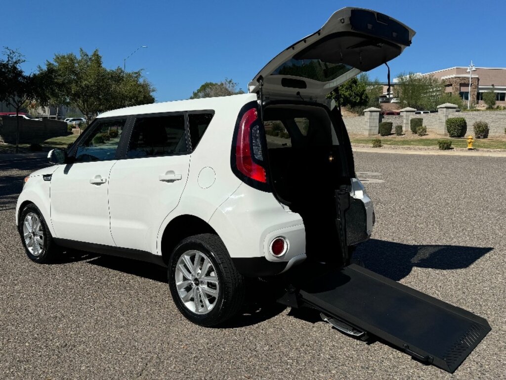 White Kia Soul with Freedom Motors Rear Entry Manual Fold Out conversion