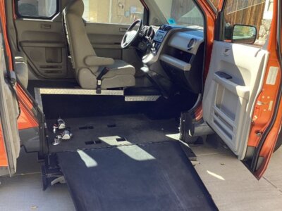 Orange Honda Element with Freedom Motors Side Entry Manual Fold Out conversion