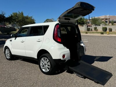 White Kia Soul with Freedom Motors Rear Entry Manual Fold Out conversion
