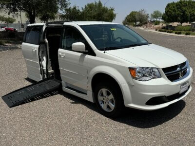 White Dodge Grand Caravan with BraunAbility Side Entry Automatic Fold Out conversion
