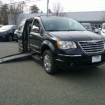 Black Chrysler Town and Country with BraunAbility Side Entry Automatic Fold Out conversion