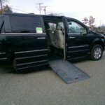 Black Chrysler Town and Country with BraunAbility Side Entry Automatic Fold Out conversion