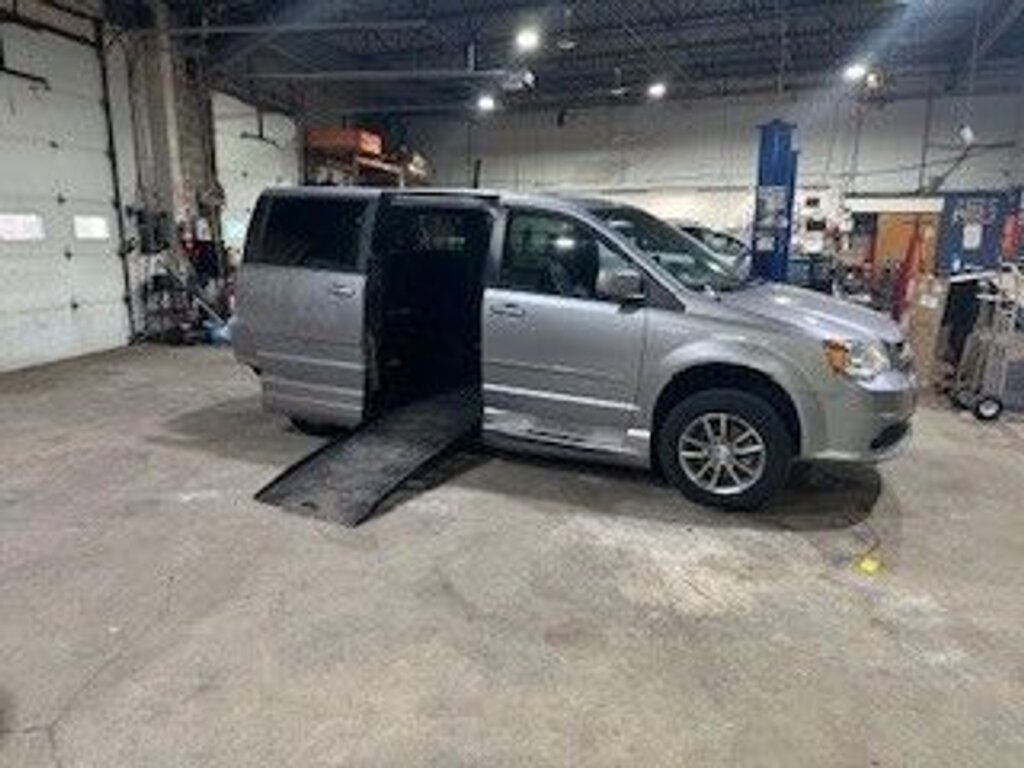 Silver Dodge Grand Caravan with BraunAbility Side Entry Automatic Fold Out conversion
