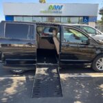 Black Dodge Grand Caravan with Adaptive Vans Side Entry Automatic Fold Out conversion
