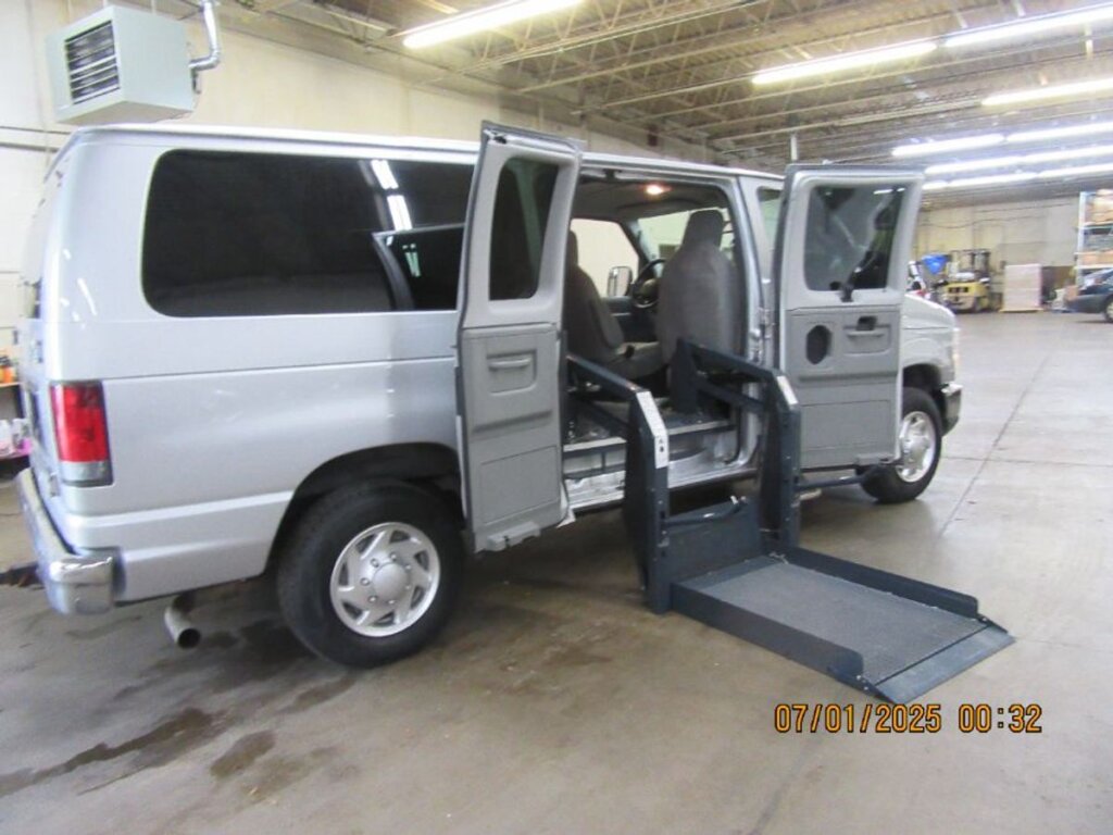Silver Ford Econoline with Other Side Entry Automatic Fold Out conversion