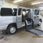 Silver Ford Econoline with Other Side Entry Automatic Fold Out conversion