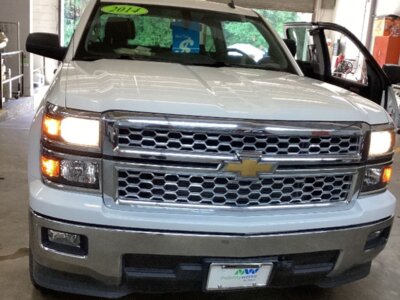 White Chevrolet Silverado 1500 with MobilitySVM Side Entry Automatic Fold Out conversion