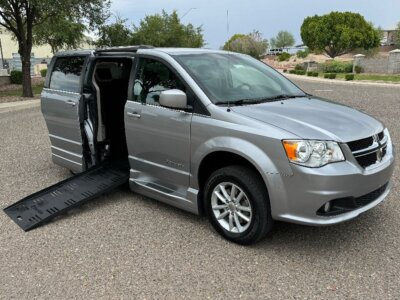 Silver Dodge Grand Caravan with BraunAbility Side Entry Automatic Fold Out conversion