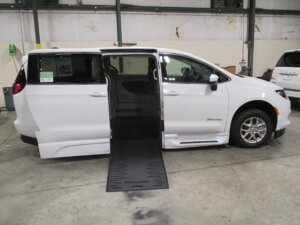 White Chrysler Voyager with BraunAbility Side Entry Automatic Fold Out conversion