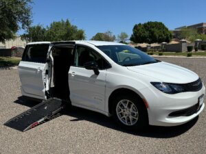 White Chrysler Voyager with Driverge Side Entry Automatic Fold Out conversion