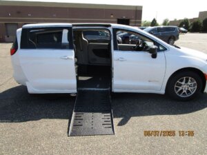 White Chrysler Voyager with Driverge Side Entry Automatic Fold Out conversion