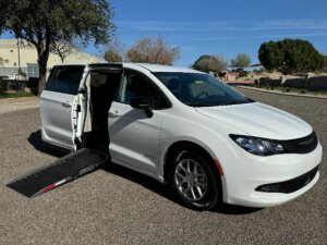 White Chrysler Voyager with Driverge Side Entry Automatic Fold Out conversion