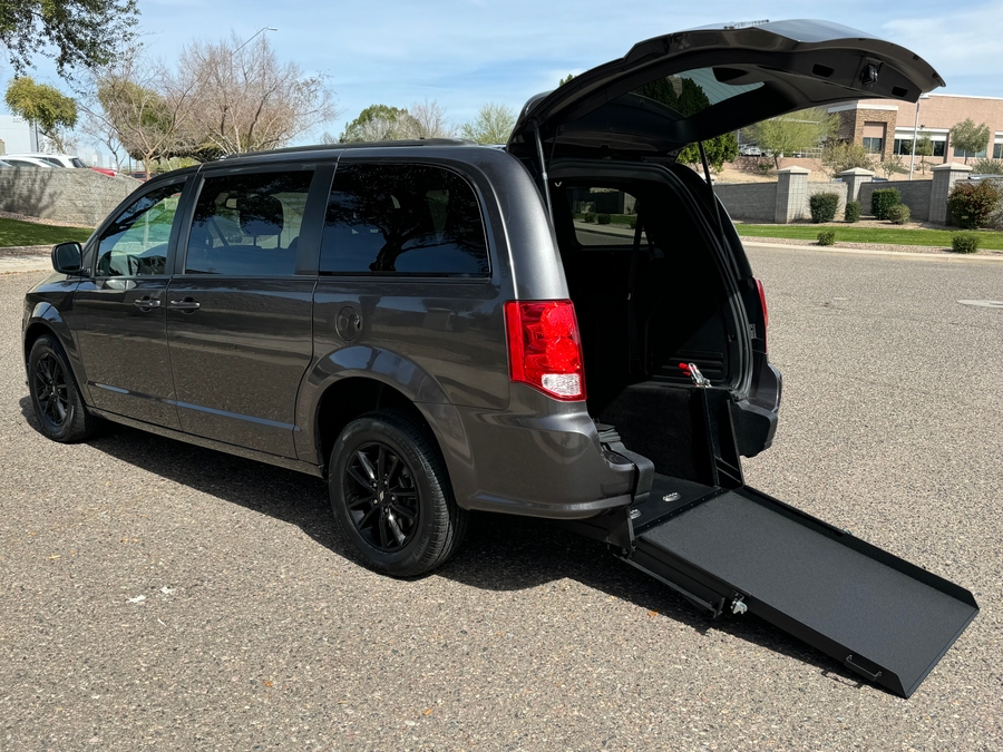 Grey Dodge Grand Caravan with International Sales and Mobility Rear Entry Manual Fold Out conversion
