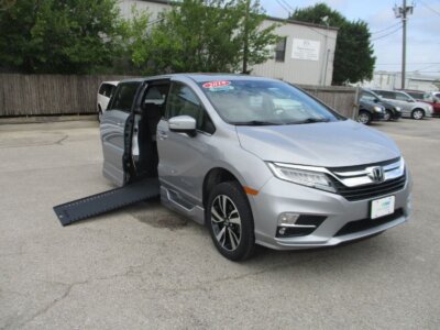 Silver Honda Odyssey with BraunAbility Side Entry Automatic In Floor conversion