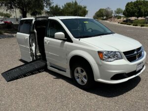 White Dodge Grand Caravan with BraunAbility Side Entry Automatic Fold Out conversion