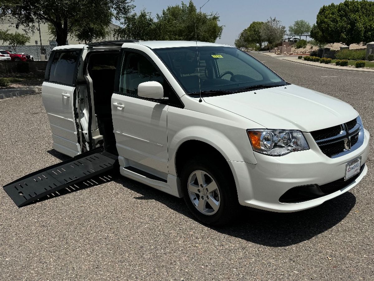 White Dodge Grand Caravan with BraunAbility Side Entry Automatic Fold Out conversion