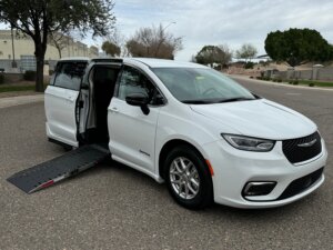 White Chrysler Pacifica with Driverge Side Entry Automatic Fold Out conversion