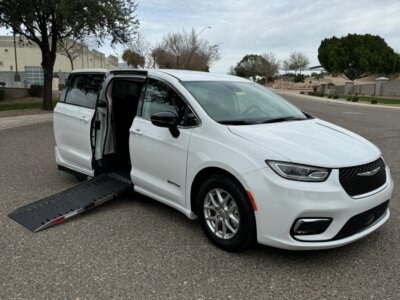 White Chrysler Pacifica with Driverge Side Entry Automatic Fold Out conversion