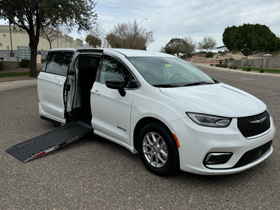 White Chrysler Pacifica with Driverge Side Entry Automatic Fold Out conversion