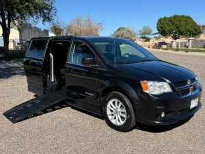 Black Dodge Grand Caravan with BraunAbility Side Entry Automatic Fold Out conversion