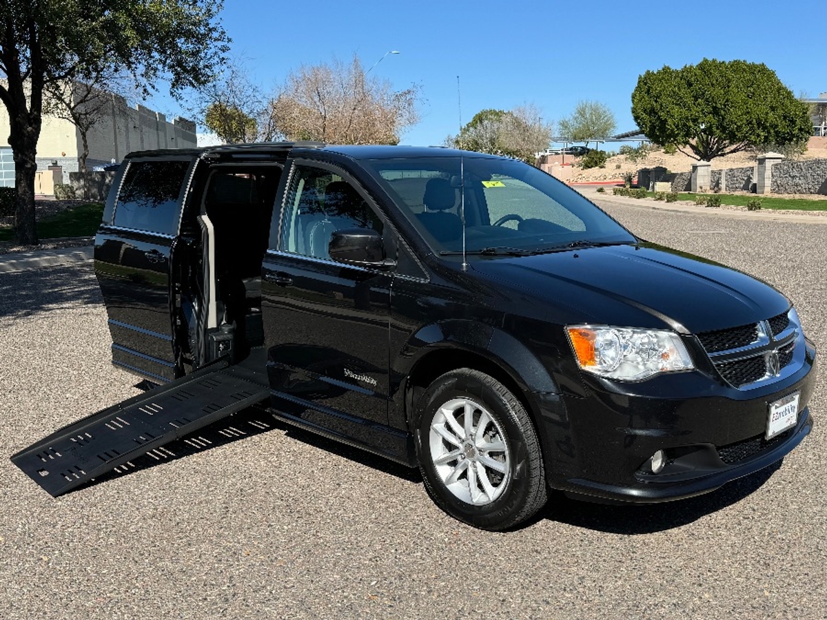 Black Dodge Grand Caravan with BraunAbility Side Entry Automatic Fold Out conversion