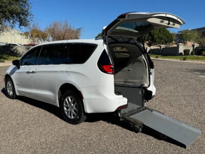 White Chrysler Pacifica with Driverge Rear Entry Manual Fold Out conversion