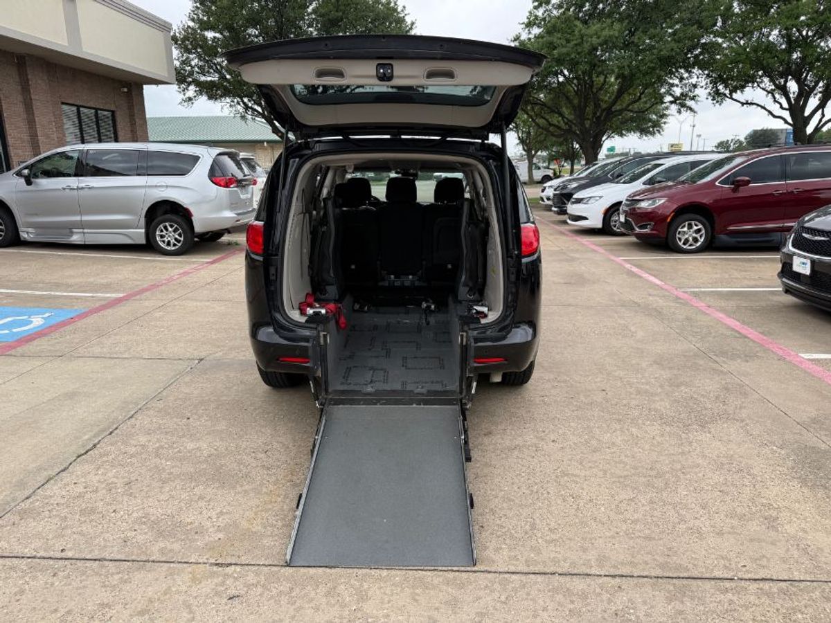 Black Chrysler Voyager with Driverge Rear Entry Manual Fold Out conversion