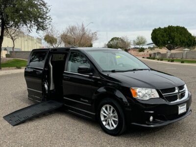 Black Dodge Grand Caravan with BraunAbility Side Entry Automatic Fold Out conversion
