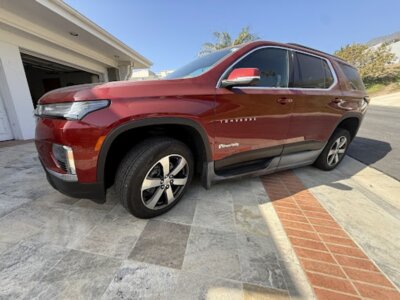 Red Chevrolet Traverse with BraunAbility Side Entry Automatic In Floor conversion