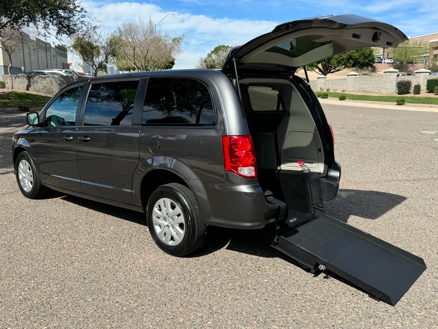 Grey Dodge Grand Caravan with International Sales and Mobility Rear Entry Manual Fold Out conversion