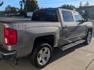 Grey Chevrolet Silverado 1500 with ATC Side Entry Automatic Lift conversion
