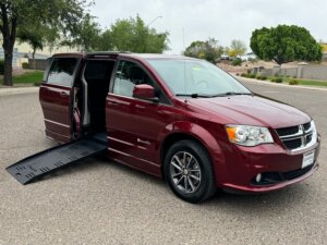 Red Dodge Grand Caravan with BraunAbility Side Entry Manual Fold Out conversion