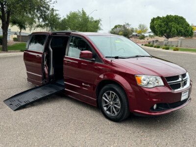 Red Dodge Grand Caravan with BraunAbility Side Entry Manual Fold Out conversion