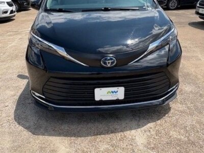 Black Toyota Sienna with Driverge Rear Entry Manual Fold Out conversion