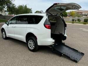 White Chrysler Voyager with FR Conversions Rear Entry Manual Fold Out conversion