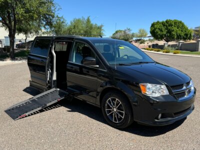 Black Dodge Caravan with Adaptive Vans Side Entry Automatic Fold Out conversion