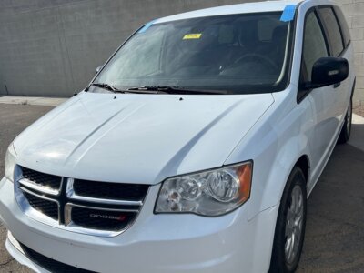 White Dodge Grand Caravan with International Sales and Mobility Rear Entry Manual Fold Out conversion