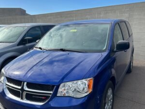 Blue Dodge Grand Caravan with International Sales and Mobility Rear Entry Manual Fold Out conversion