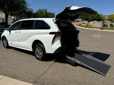 White Toyota Sienna with Driverge Rear Entry Manual Fold Out conversion