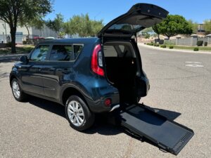 Blue Kia Soul with Freedom Motors Rear Entry Manual Fold Out conversion