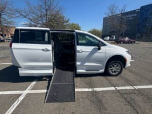 White Chrysler Voyager with Driverge Side Entry Automatic Fold Out conversion